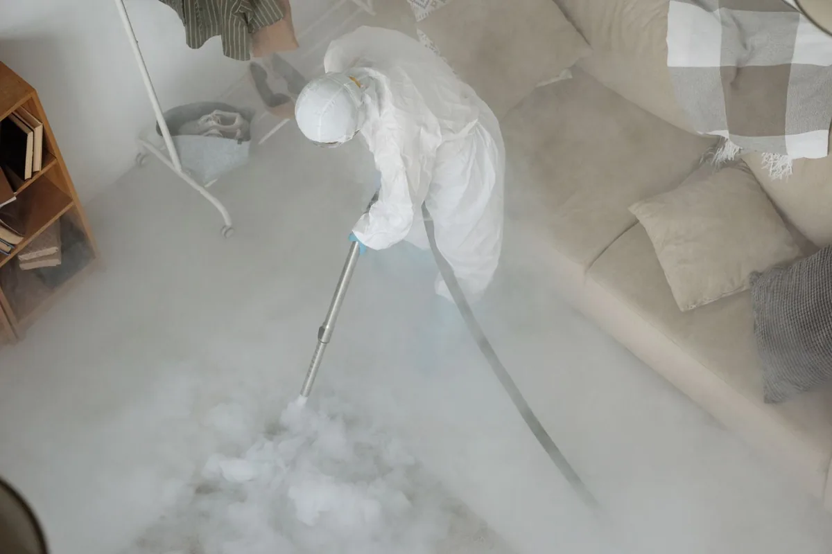 Biohazard cleanup technician in protective equipment, Doe Valley, KY
